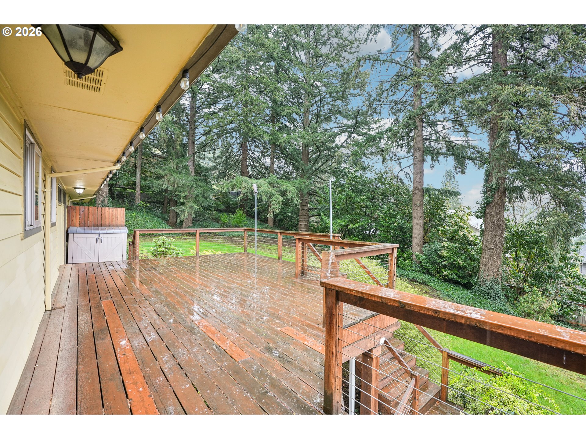 12444 Southwest 57th Avenue Portland, OR 97219 - Photo 37 of 44 a view of a balcony with wooden floor and fence