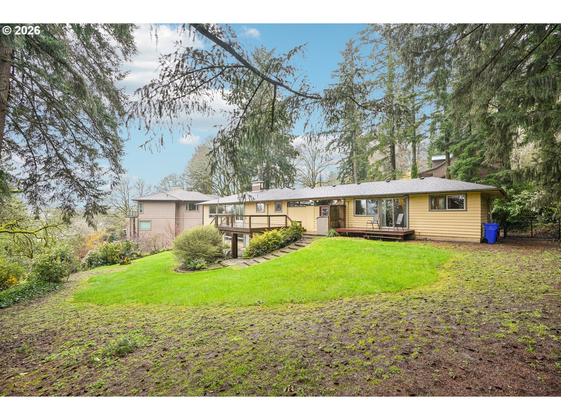 12444 Southwest 57th Avenue Portland, OR 97219 - Photo 43 of 44 a view of a house with backyard and trees