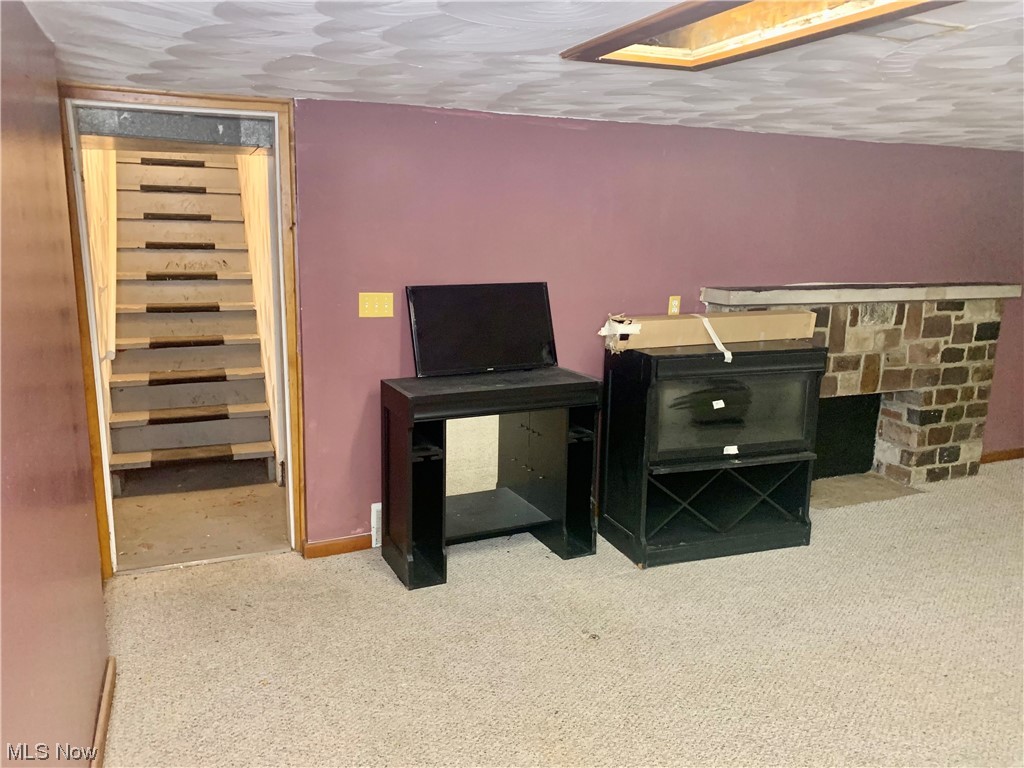 665 Dorchester Road Akron, OH 44320 - Photo 18 of 18 Office area with light colored carpet and a fireplace
