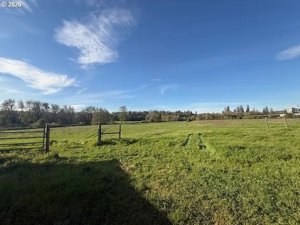a view of a backyard with a barn