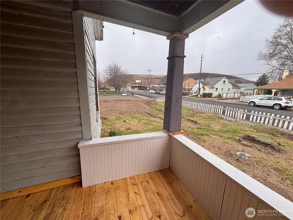 a view of a back yard from a balcony