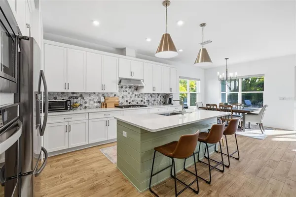 a view of a dining room with furniture window and outside view
