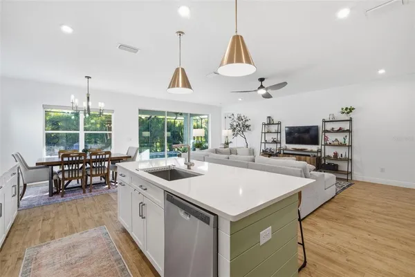a bedroom with a bed a couch and bookshelf
