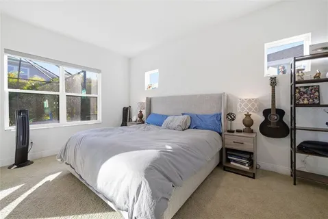 a view of a workspace with furniture and wooden floor