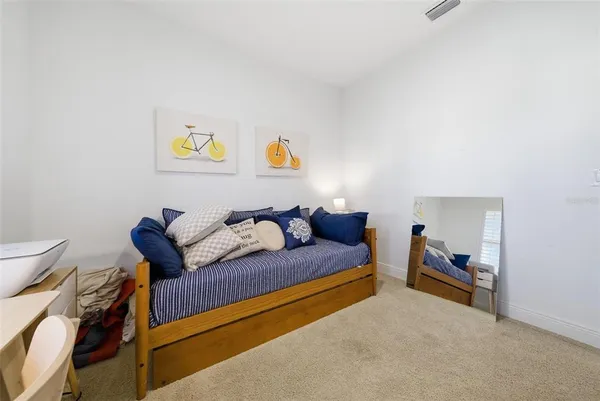 a view of a patio with a table chairs and a backyard