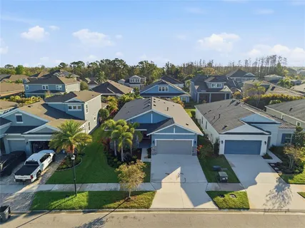 a swimming pool with outdoor seating and yard