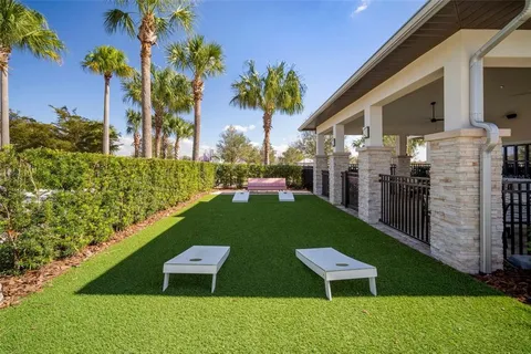 an aerial view of a house with swimming pool garden and outdoor seating