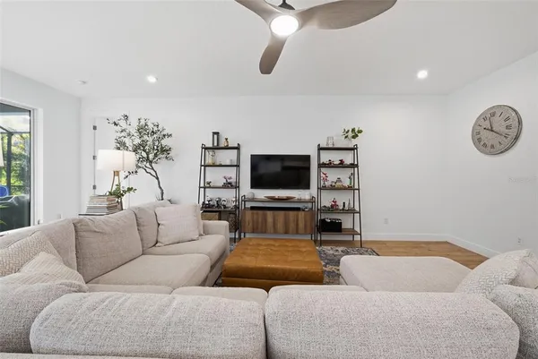 a large kitchen with kitchen island a stove a sink a center island and a stove top oven