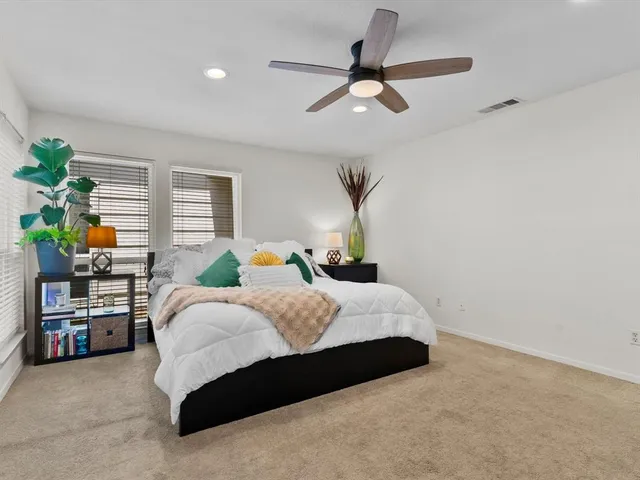 a bedroom with a bed furniture and a window
