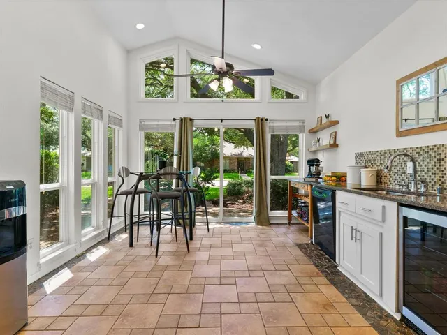 a view of a dining room with furniture water and chandelier