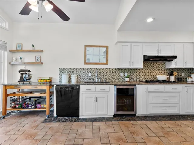 a kitchen with a stove and cabinets