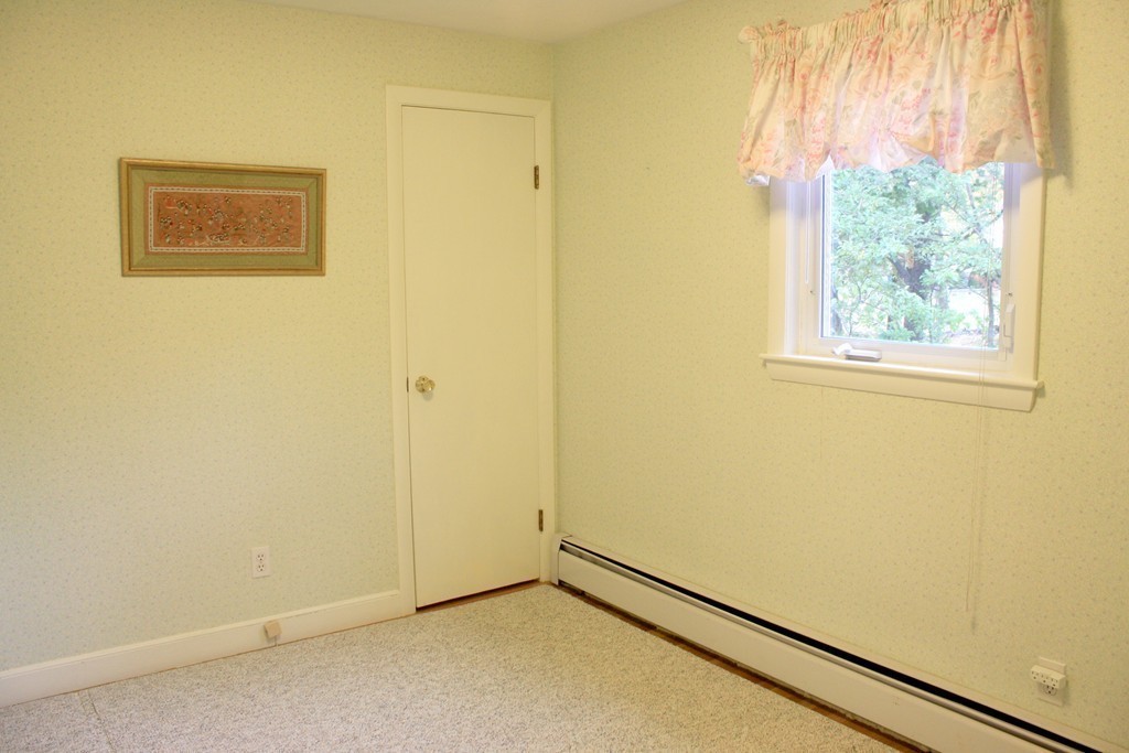74 Yerxa Road Arlington, MA 02474 - Photo 12 of 16 an empty room with windows