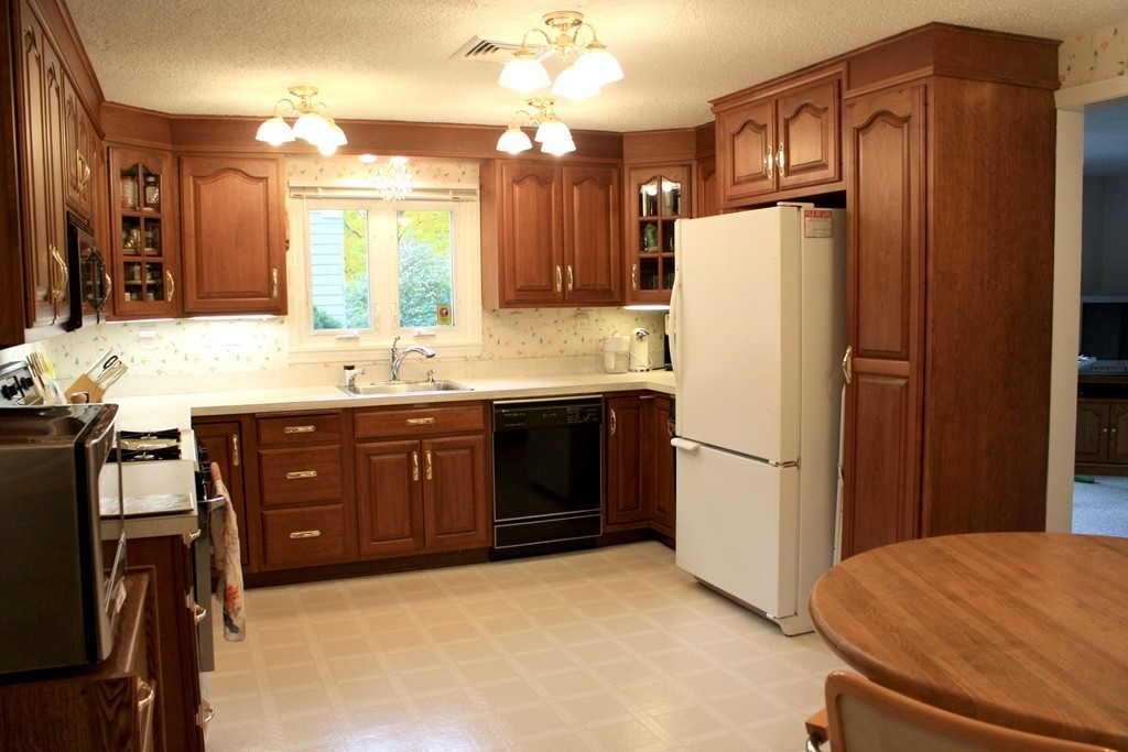 74 Yerxa Road Arlington, MA 02474 - Photo 3 of 16 a kitchen with stainless steel appliances a refrigerator and a sink