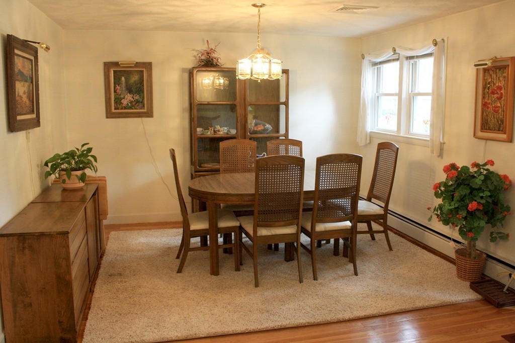 74 Yerxa Road Arlington, MA 02474 - Photo 4 of 16 a view of a dining room with furniture and wooden floor