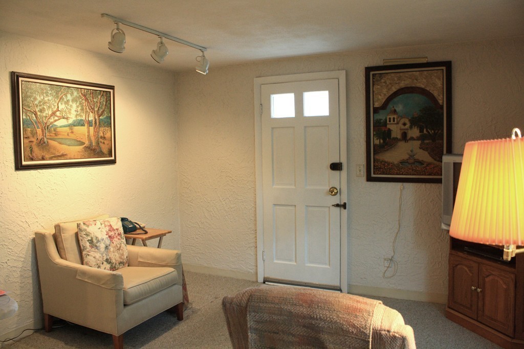 74 Yerxa Road Arlington, MA 02474 - Photo 5 of 16 a bedroom with a bed and couch