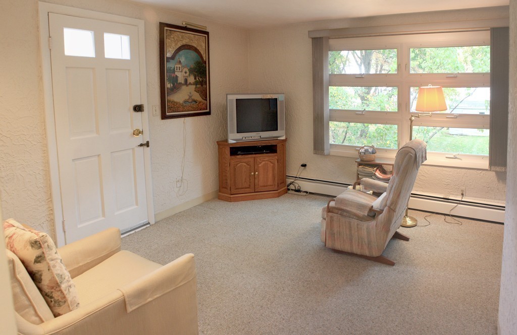 74 Yerxa Road Arlington, MA 02474 - Photo 6 of 16 a living room with furniture and a flat screen tv