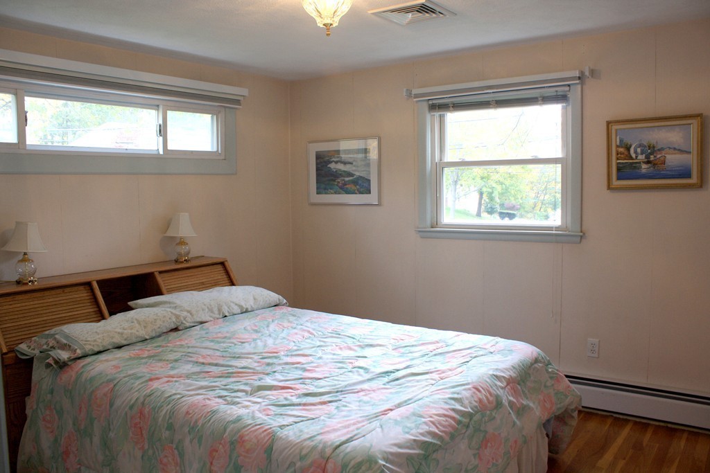 74 Yerxa Road Arlington, MA 02474 - Photo 9 of 16 a bedroom with a bed and a window
