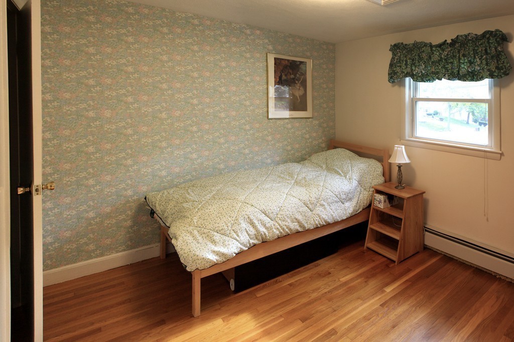 74 Yerxa Road Arlington, MA 02474 - Photo 10 of 16 a bedroom with a bed and a window
