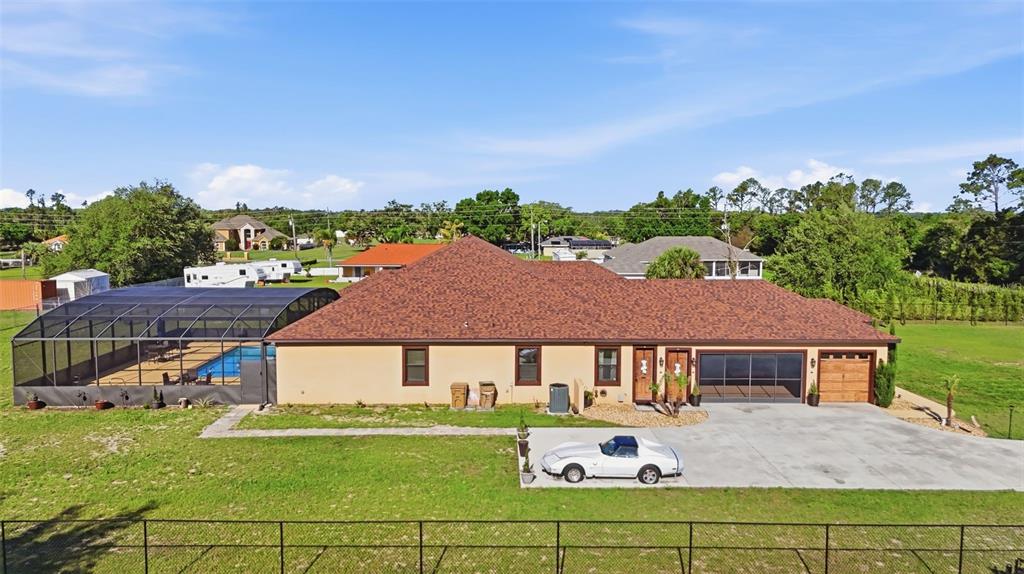 13429 Montevista Road Clermont, FL 34711 - Photo 76 of 89 an aerial view of a house with a garden