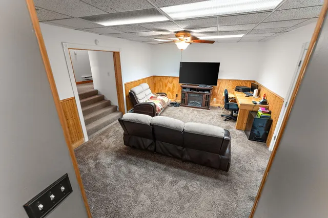 an empty room with windows and closet