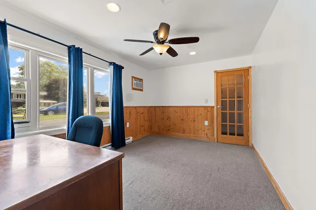 a view of an empty room with a fireplace and a window