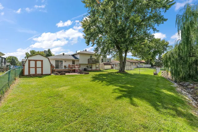 a view of a house with swimming pool and sitting area