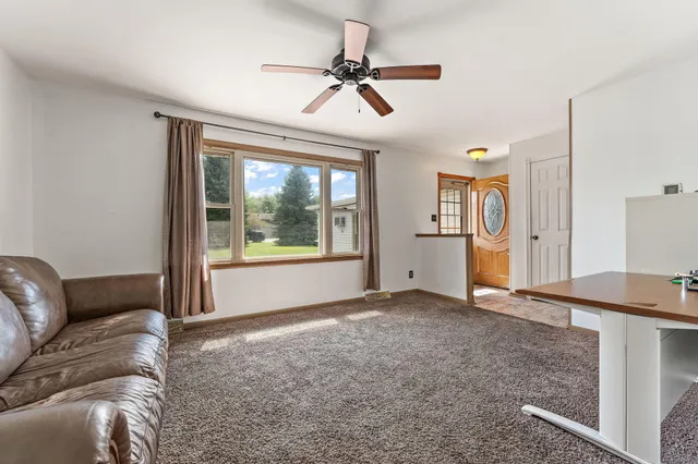 a living room with furniture and a window
