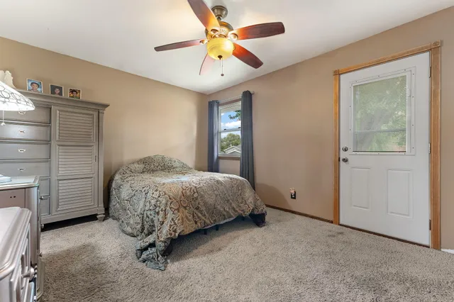 a spacious bedroom with a bed and a closet