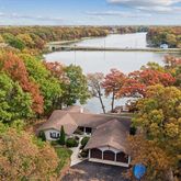 an aerial view of a house with a lake view