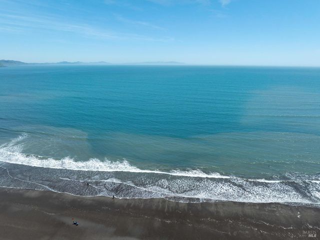 a front view of a building with glass windows and door