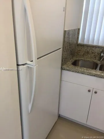 a bathroom with a sink and a shower