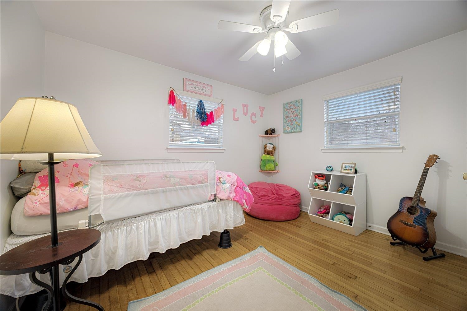 524 Mineral Road Memphis, TN 38120 - Photo 11 of 26 a bedroom with a bed and a chandelier