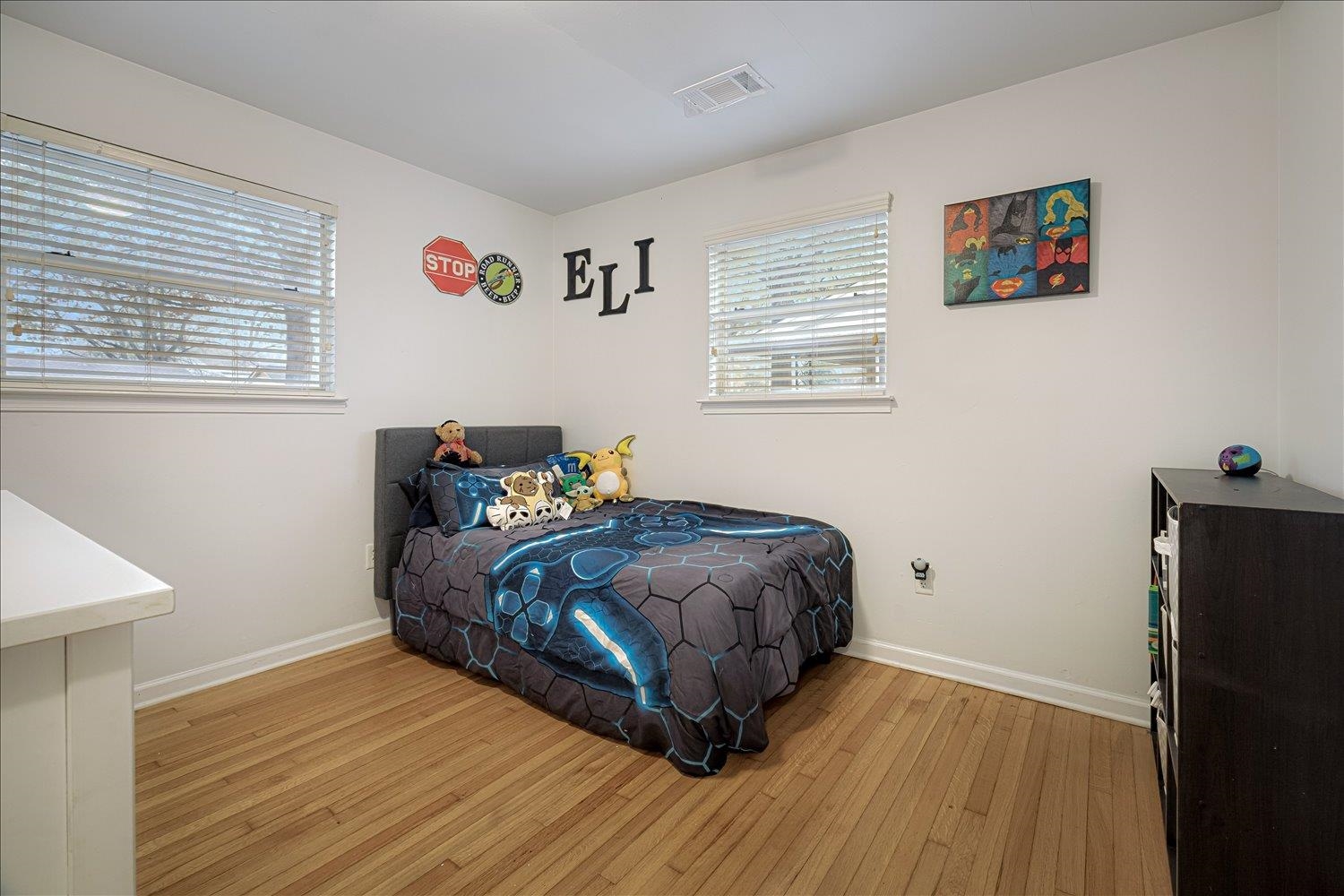 524 Mineral Road Memphis, TN 38120 - Photo 12 of 26 a bedroom with a bed and wooden floor