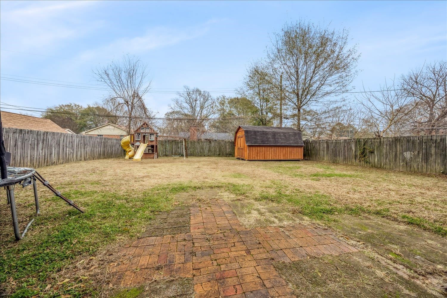 524 Mineral Road Memphis, TN 38120 - Photo 17 of 26 a house with trees in front of it