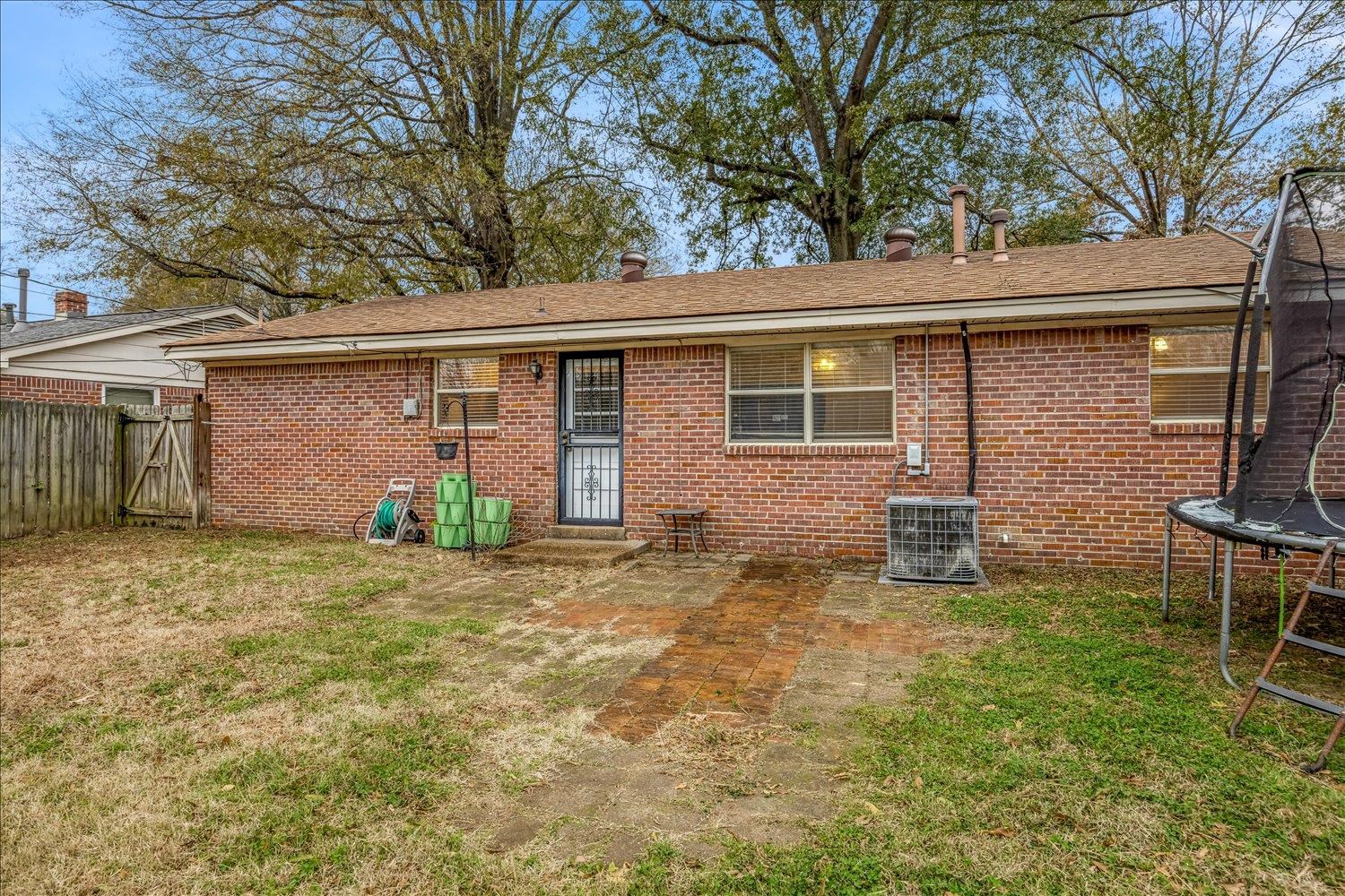 524 Mineral Road Memphis, TN 38120 - Photo 24 of 26 a backyard of a house with table and chairs