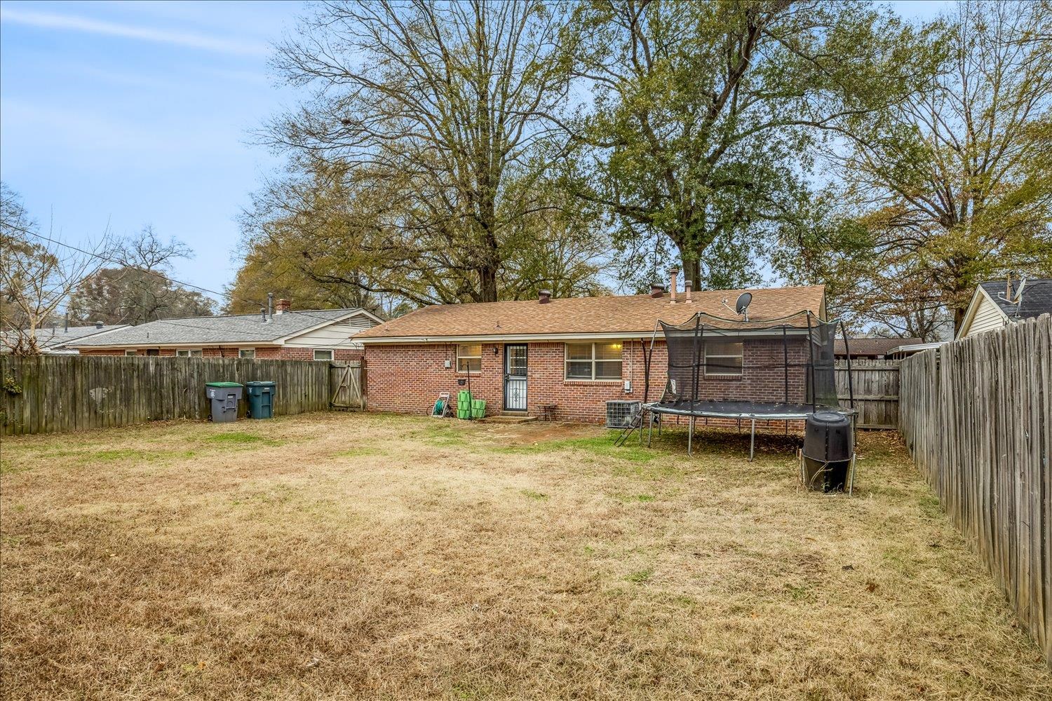 524 Mineral Road Memphis, TN 38120 - Photo 25 of 26 a view of a house with a yard and roof