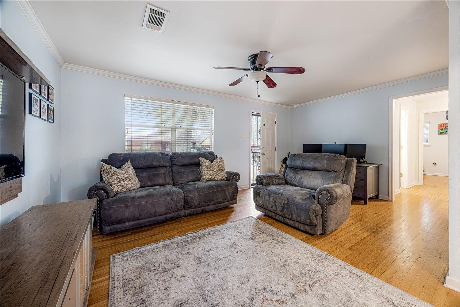 524 Mineral Road Memphis, TN 38120 - Photo 3 of 26 a living room with furniture and a flat screen tv