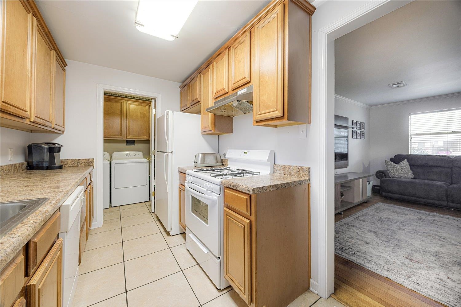 524 Mineral Road Memphis, TN 38120 - Photo 7 of 26 a kitchen with a stove a sink and a refrigerator