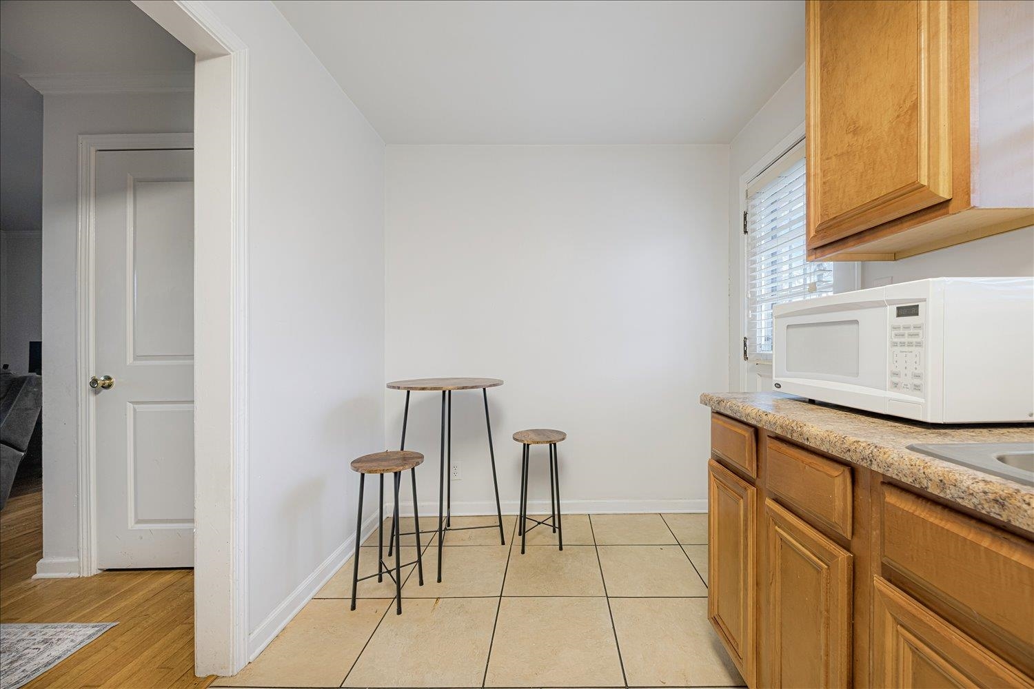 524 Mineral Road Memphis, TN 38120 - Photo 9 of 26 a kitchen with stainless steel appliances granite countertop a sink and a refrigerator