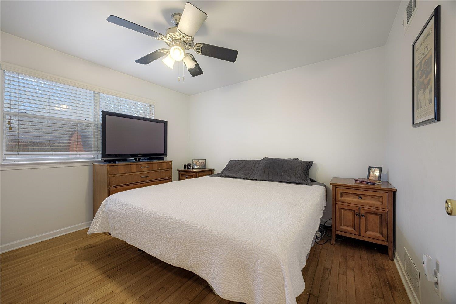 524 Mineral Road Memphis, TN 38120 - Photo 10 of 26 a bedroom with a bed and a flat screen tv