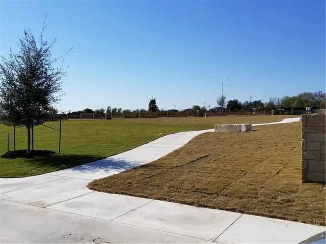a view of a lake with a big yard