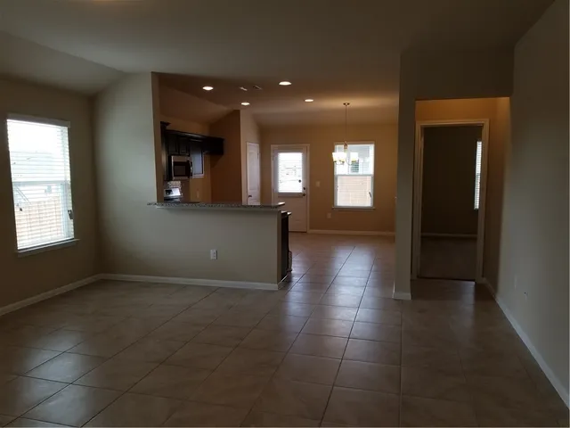 a view of hallway with a window