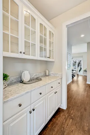 a living room with furniture flat screen tv and a large window