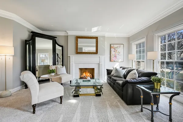 a living room with furniture or couch and a large window