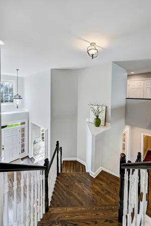 a bathroom with a granite countertop sink a large mirror and a bathtub