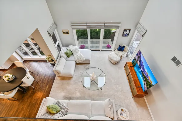 a bathroom with a granite countertop sink mirror and toilet