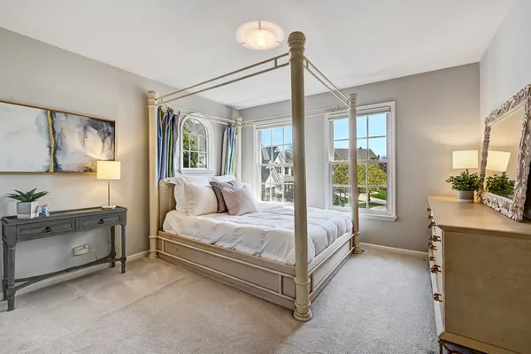 a living room with furniture and a bookshelf