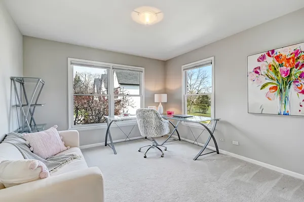 a kitchen with stainless steel appliances granite countertop a sink table and chairs