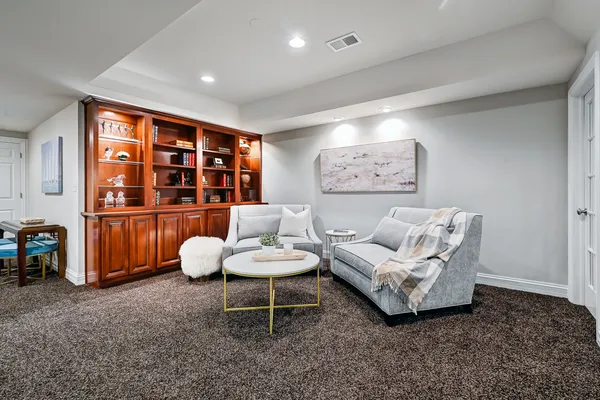 a view of a house with a backyard porch and sitting area
