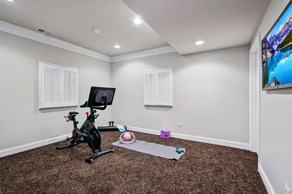 a view of a patio with table and chairs potted plants with wooden fence